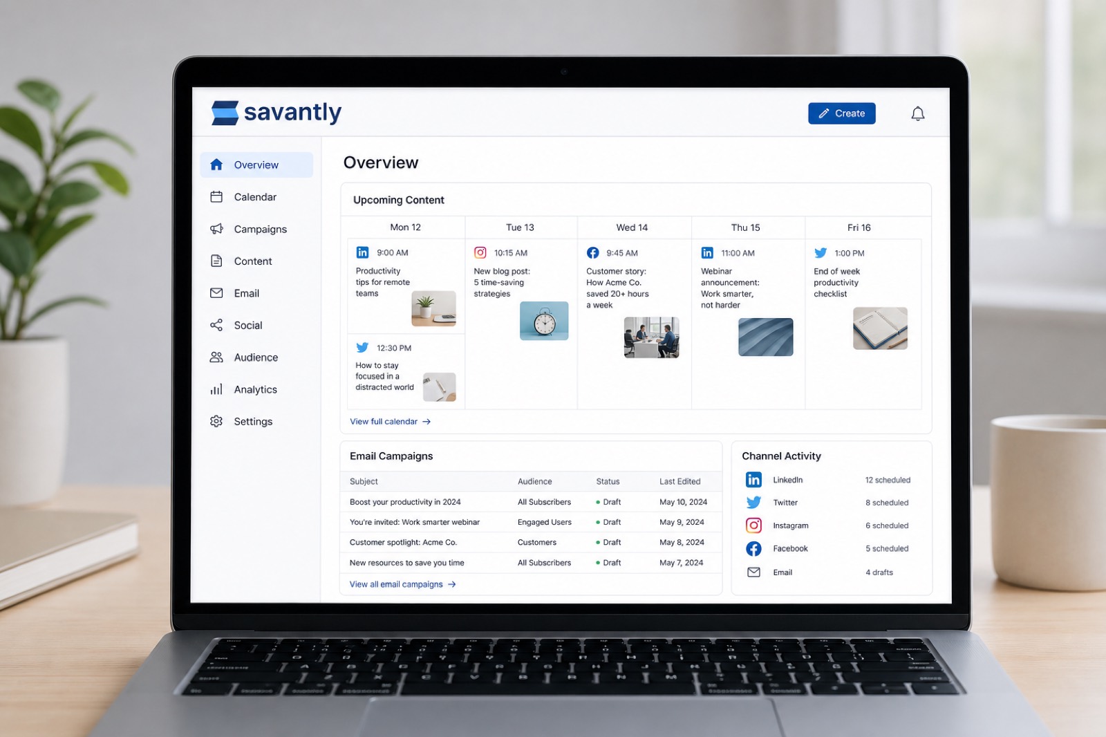 Workspace with social and email campaign drafts on a laptop